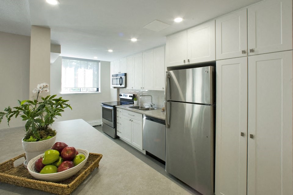 Kitchen with stainless steel appliances at Highpoint Apartments in Barrie