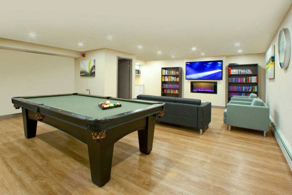 Prince Court Princess Manor in Welland, ON billiards room with lounge seating
