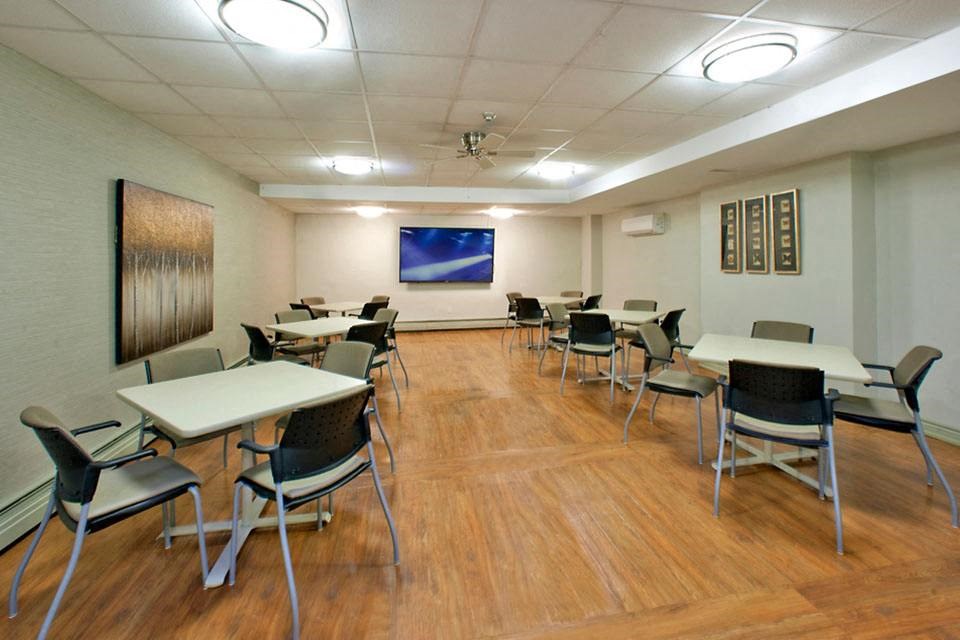Prince Court Princess Manor in Welland, ON social room with tables and chairs