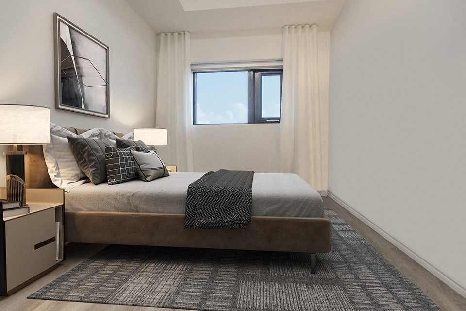 Second bedroom in a 2 bedroom 2 bathroom variation staged as a bedroom with a double bed