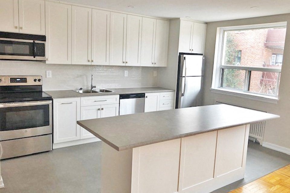 Berry Road in Etobicoke, ON kitchen with modern cabinetry and countertops