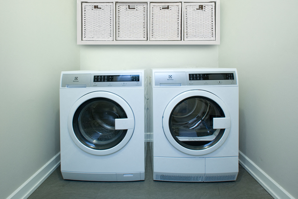 190 Cityview in Brampton, ON In suite washer and dryer with shelves above both