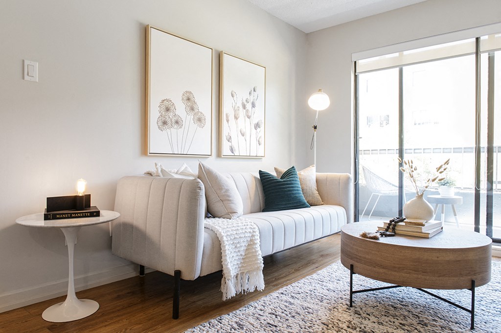 Glades on 55 living area featuring large brightly lit walkout to balcony in Langley, BC