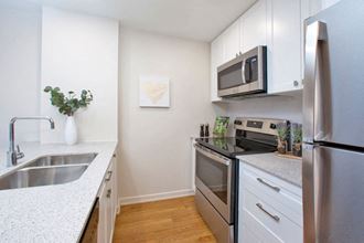 Britannia by the Bay in Ottawa, ON kitchen with breakfast bar and upgraded cabinetry