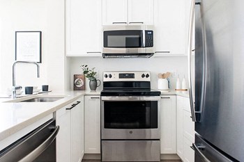 Inlet Glen Apartments in Port Moody, BC kitchen with stainless steel appliances - Photo Gallery 5