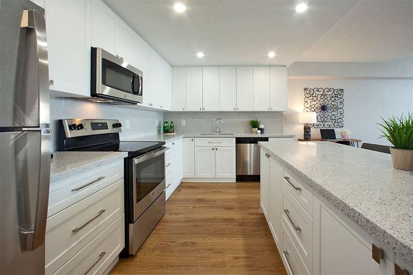 Royal Rose in Etobicoke, ON kitchen includes stainless steel appliances and upgraded cabinetry and quartz countertops - Photo Gallery