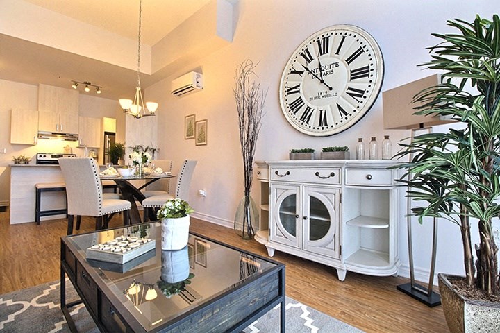 La Voile Boisbriand open-concept living area with view into kitchen in Boisbriand, QC