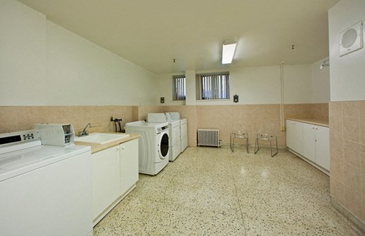 300 St. Clair Ave West in Toronto, ON Amenity room with washer, dryer, and sink
