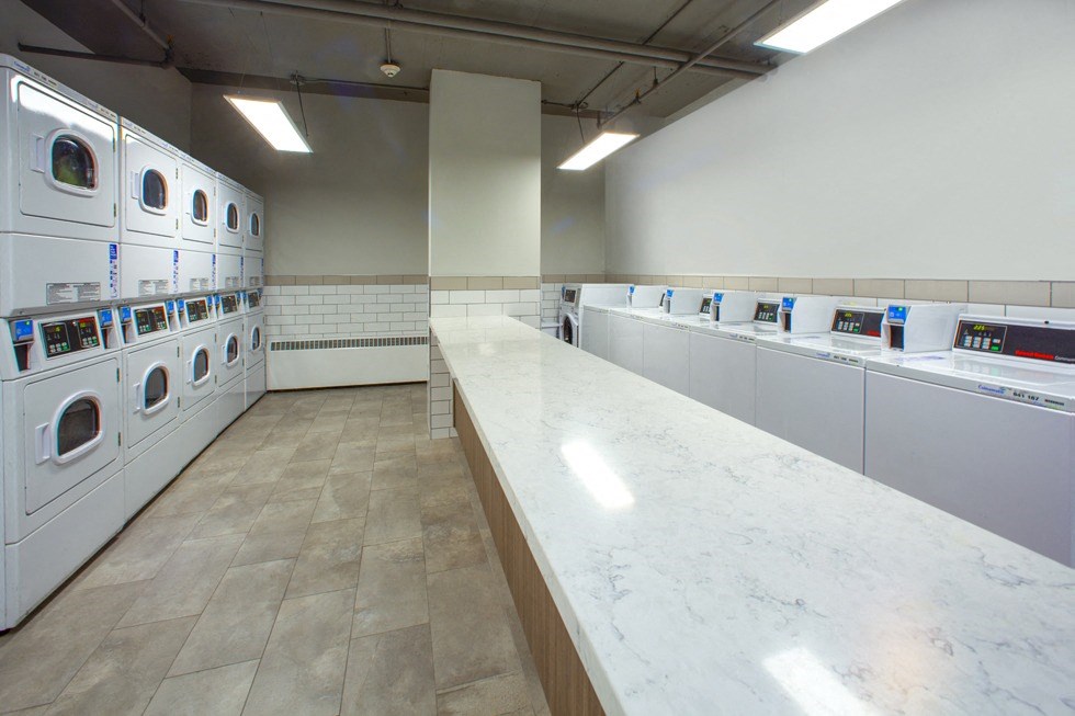 Main Square Apartments in Toronto, ON on-site laundry room with washer and dryer