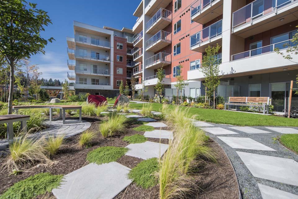 Inlet Glen Apartments property exterior featuring walkway in Port Moody, BC