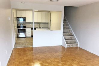 5062-5078 Dundas Street in Etobicoke, ON spacious living room open to kitchen - Photo Gallery