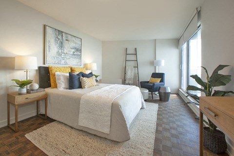 La Salle Towers primary bedroom featuring large windows in Burlington, ON