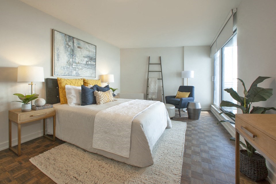 La Salle Towers primary bedroom featuring large windows in Burlington, ON