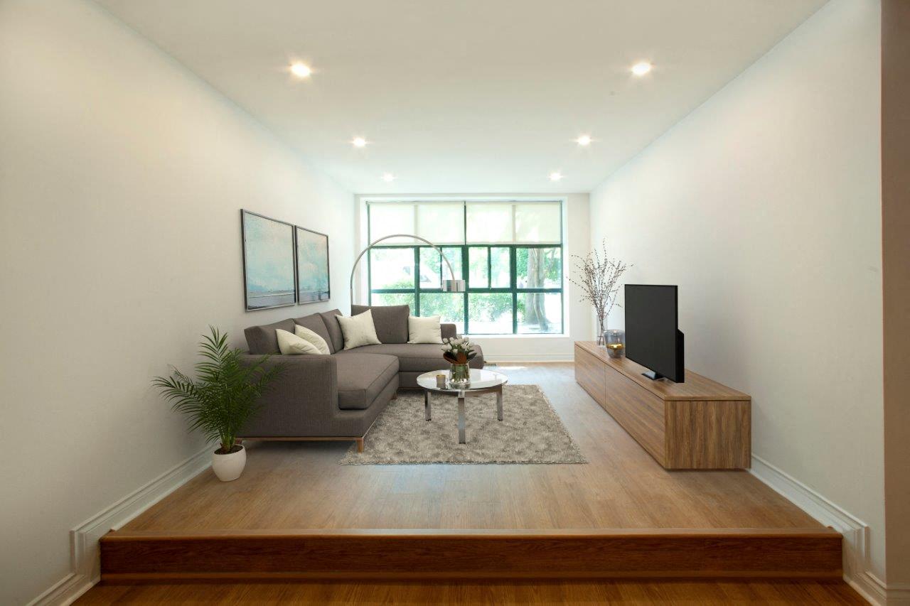a living room with a couch and a tv