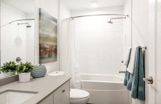 Classic, generously designed bathrooms at 99 Jasper in Edmonton, AB