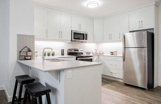 Upgraded kitchen with stainless steel appliances at 99 Jasper in Edmonton, AB
