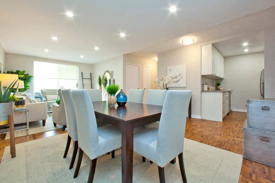 Acton Apartments dining area that comfortably fits large table with eight chairs in Acton, ON