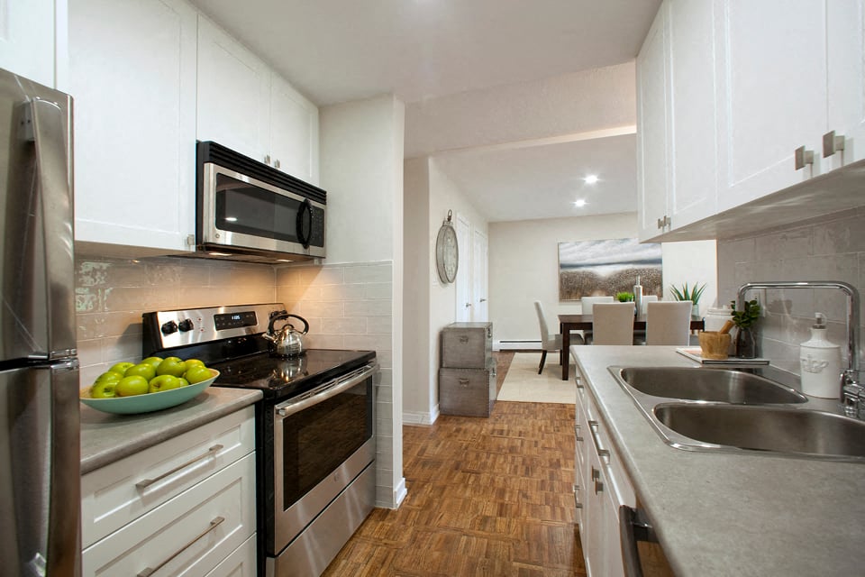 Acton Apartments kitchen with stainless steel appliances and over