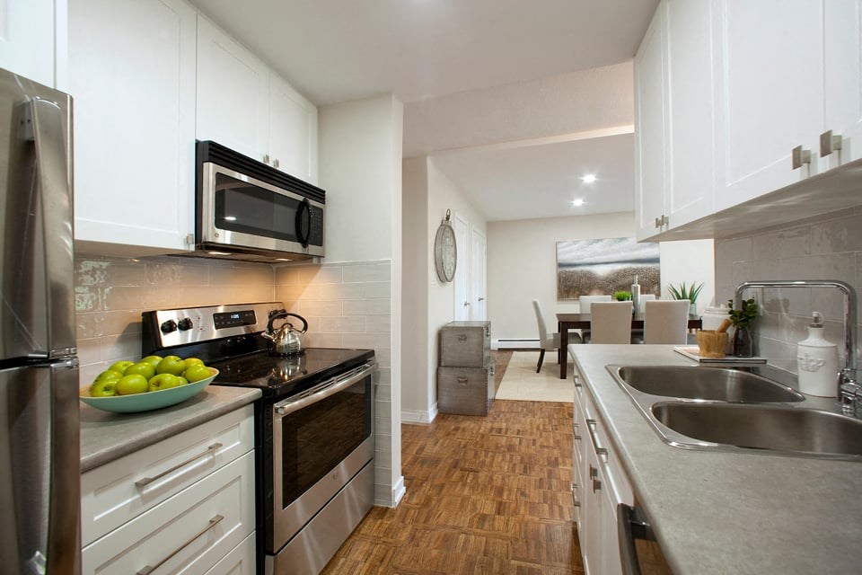 Acton Apartments kitchen with stainless steel appliances and over