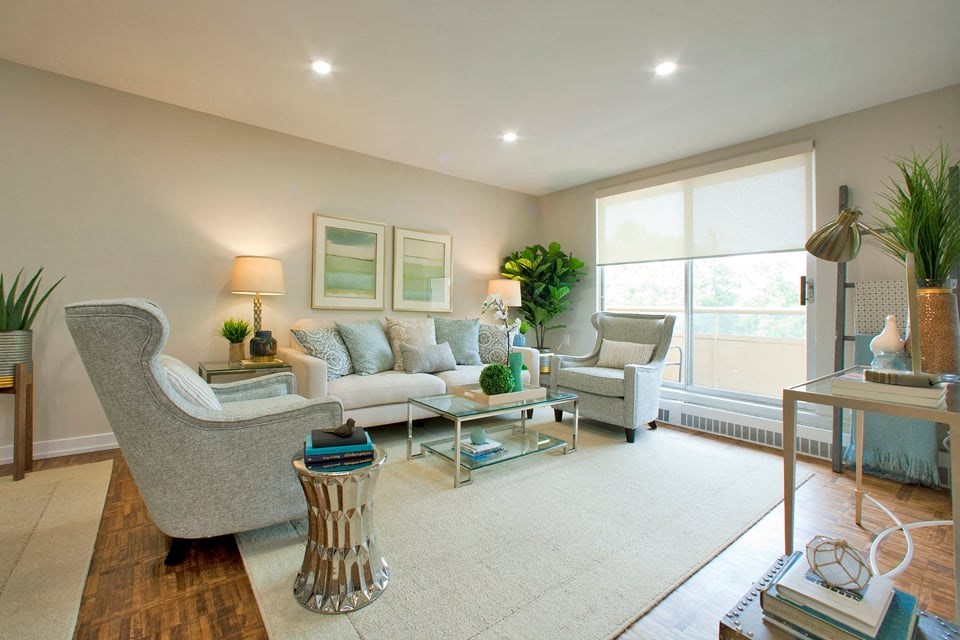 Acton Apartments living room with hardwood flooring and access to balcony in Acton, ON