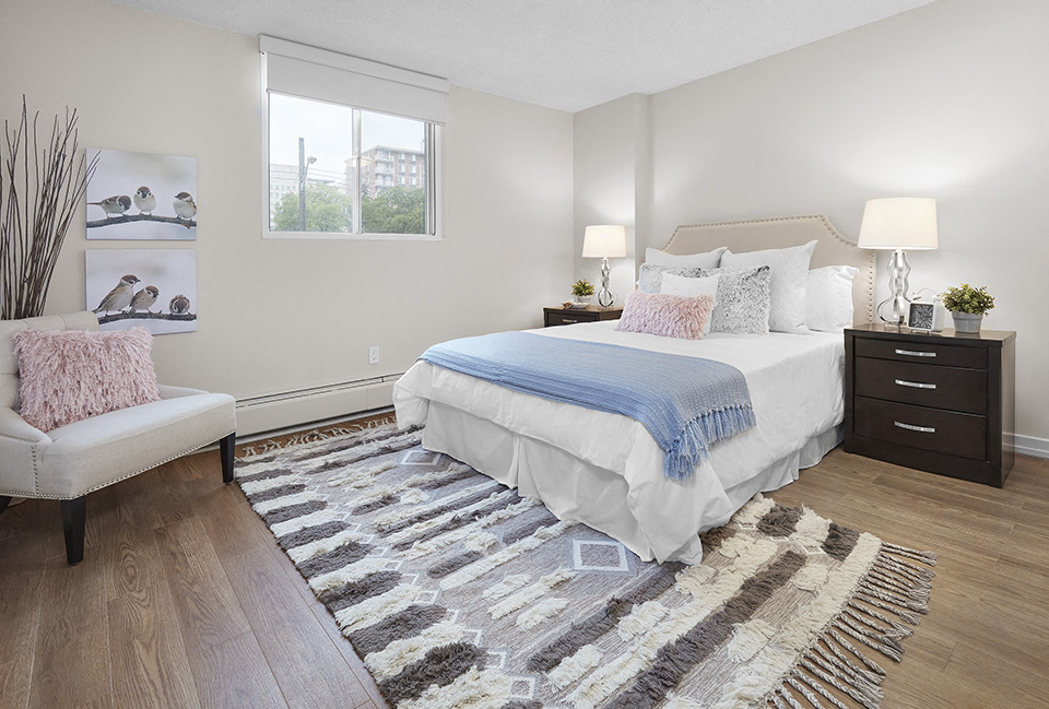 Avalon Apartments bedroom featuring luxury vinyl flooring in Edmonton, AB