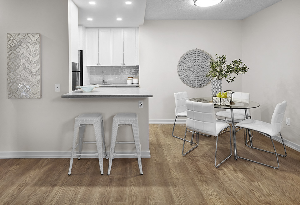 Avalon Apartments kitchen and dining room featuring breakfast bar in Edmonton, AB