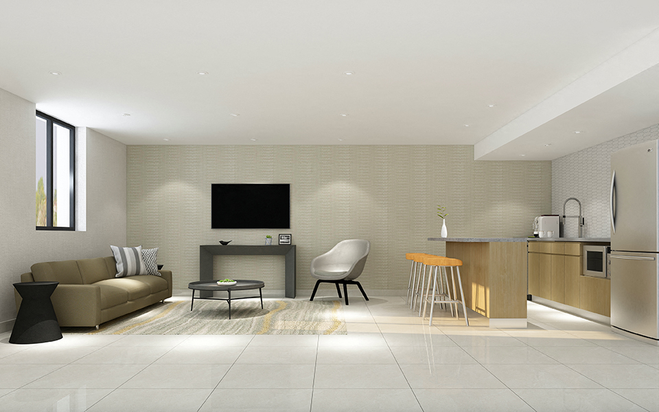 Avalon Apartments spacious social room featuring lounge seating and flat screen tv in Edmonton, AB