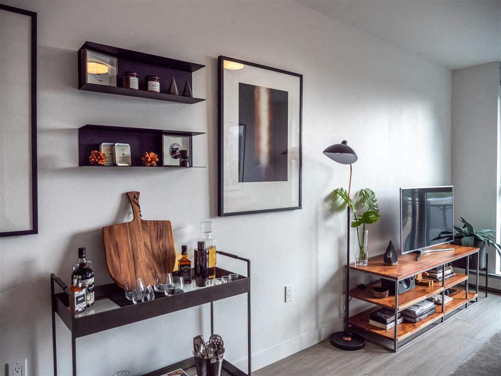 Living room with media stand at The Duke in Vancouver, BC