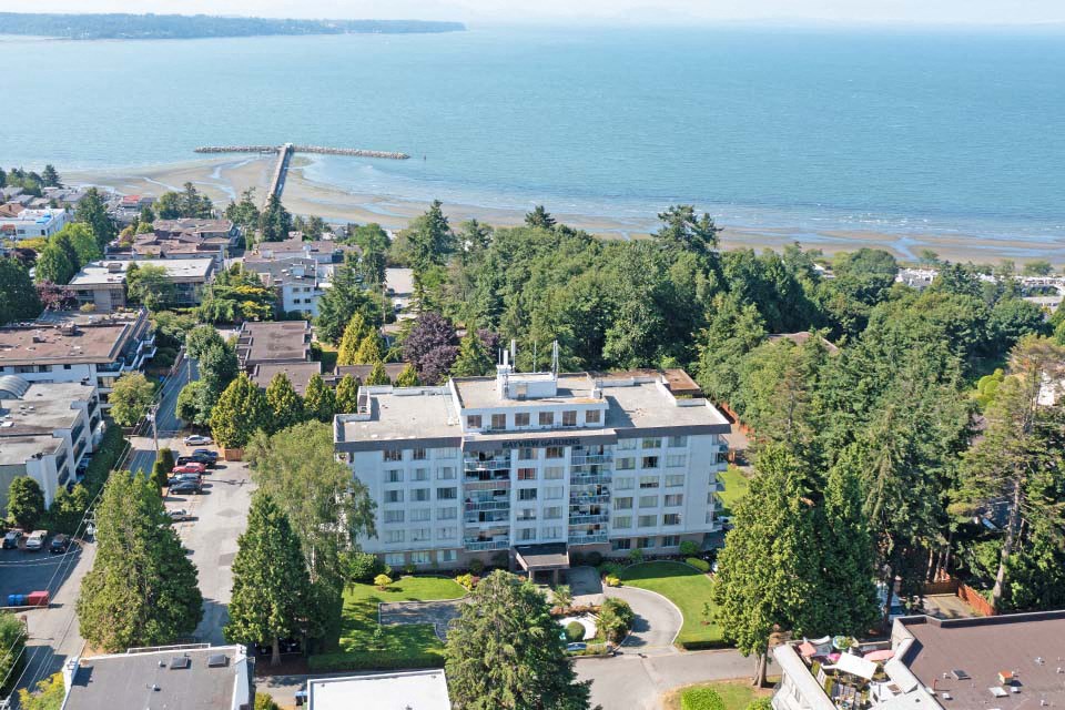 Bayview Gardens Apartments drone image of property with waterfront view in White Rock, BC