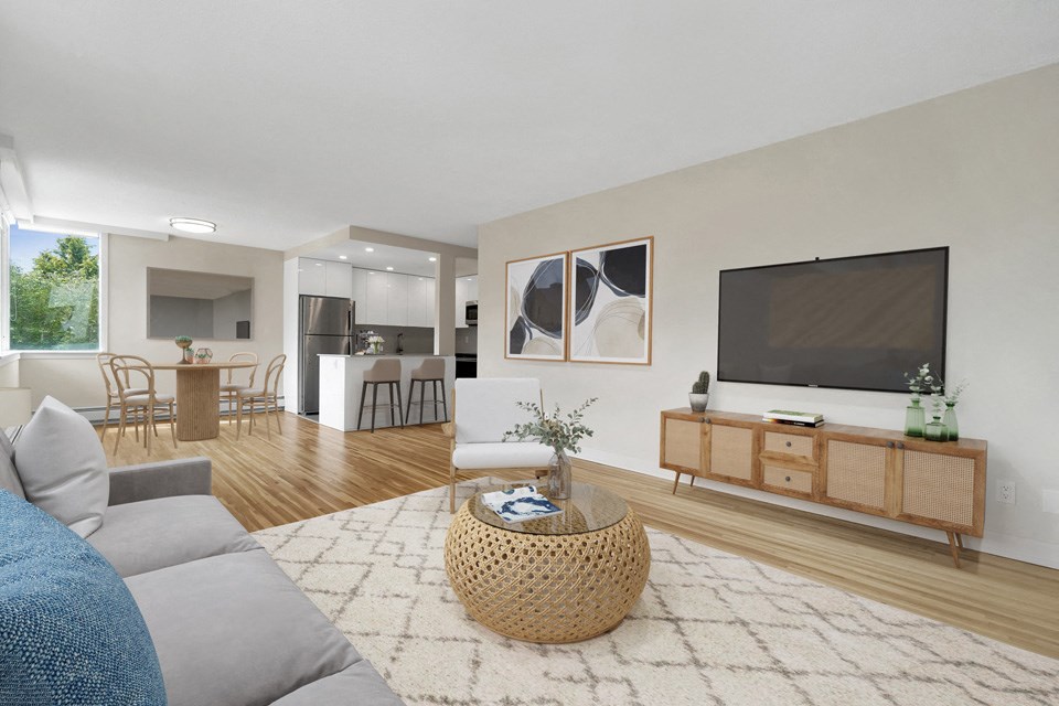 Bayview Gardens Apartments open-concept living room featuring large brightly lit windows in White Rock, BC