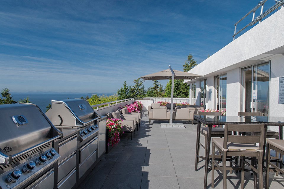 Bayview Gardens Apartments outdoor patio featuring bbq area with seating in White Rock, BC