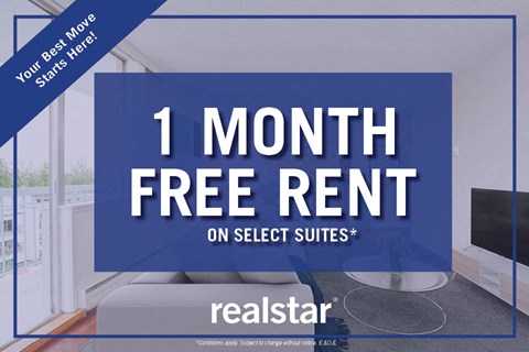 a 1 month free rent on select suites with a tv in a room