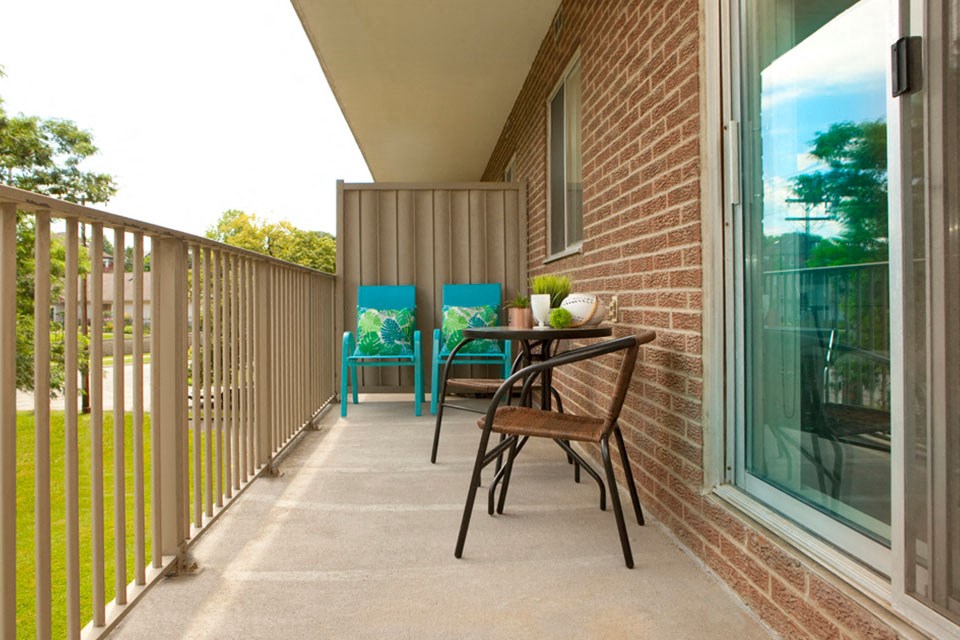 In-suite balcony with seating at Bayview Towers in Sarnia, ON