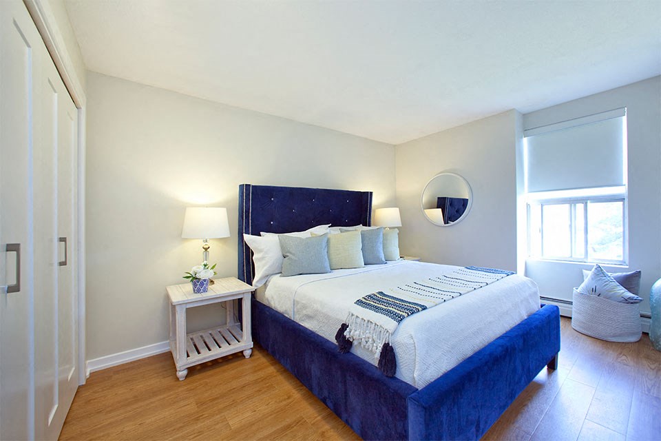 Bright bedroom with window at Bayview Towers in Sarnia, ON