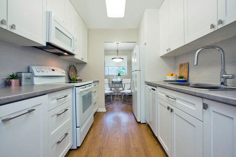 Kitchen with upgraded cabinets, counters and flooring at Bayview Towers in Sarnia, ON