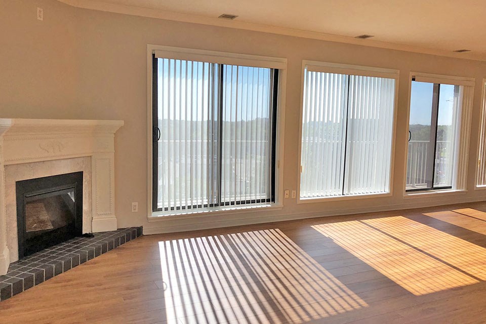 Penthouse living room with access to balcony at Bayview Towers in Sarnia, ON