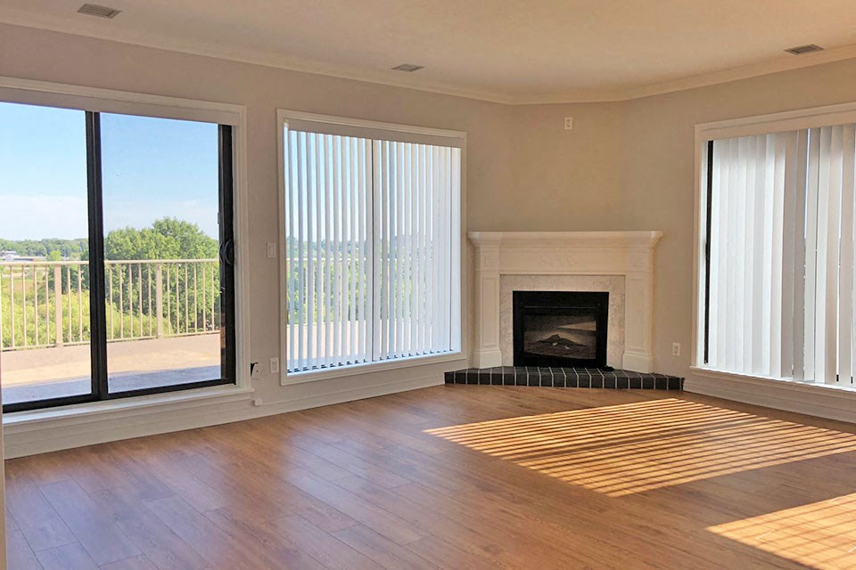 Penthouse living room with fireplace at Bayview Towers in Sarnia, ON