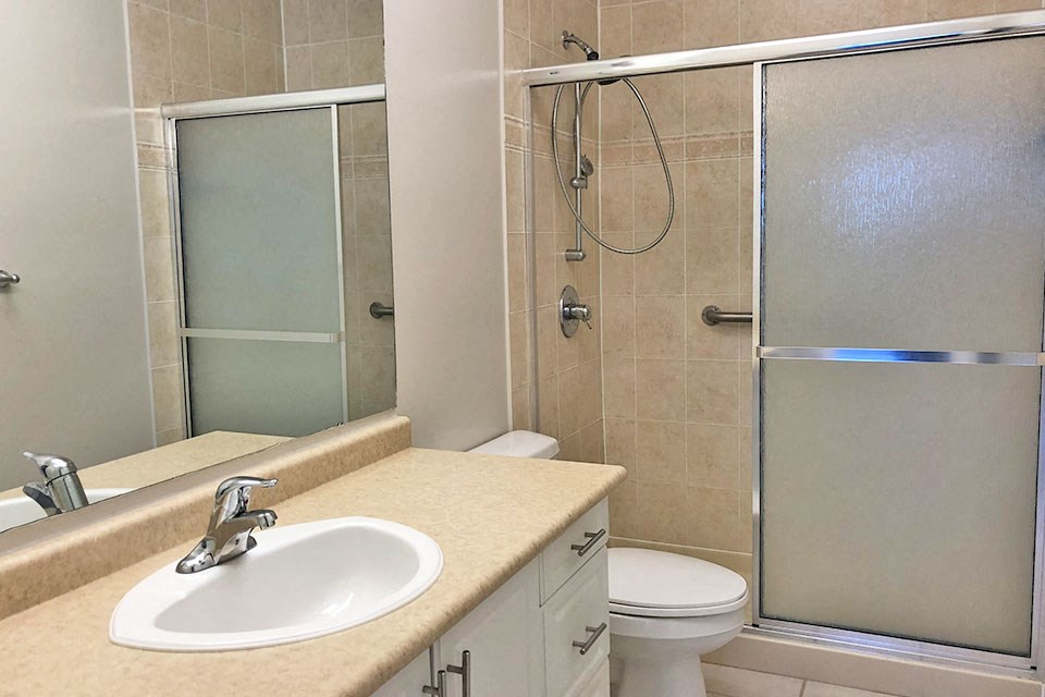 Master ensuite bathroom with stand in shower at Bayview Towers in Sarnia, ON