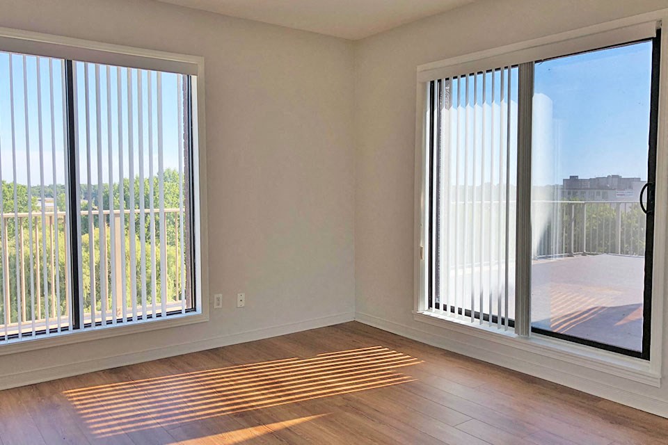 Bright master bedroom with two windows at Bayview  Towers in Sarnia, ON