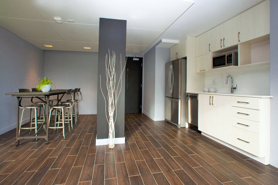 BeachHill Apartments social room featuring kitchenette and bar stool seating in Toronto, ON