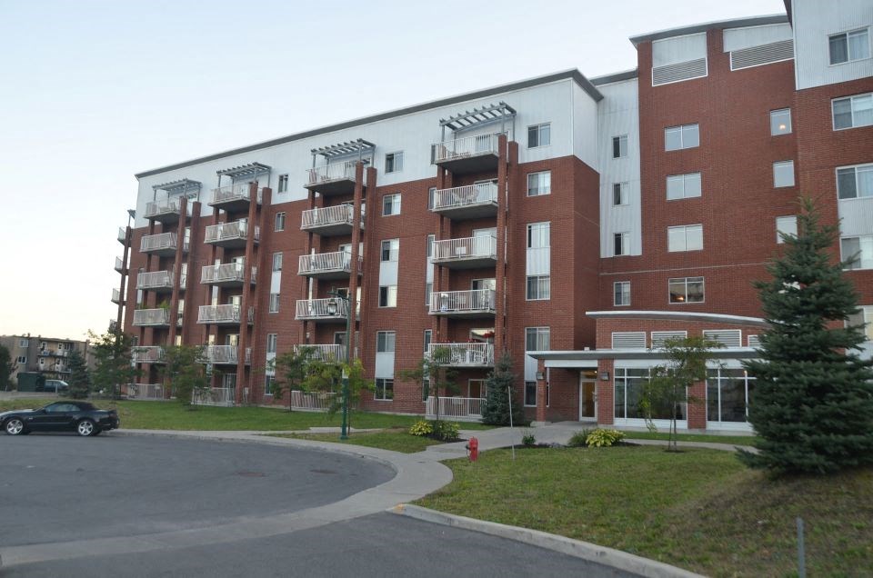 Bourg du Village front of building in Sainte Therese, QC