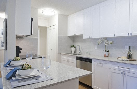 Braemar Gardens apartments kitchen featuring stainless steel appliances and white cupboards in Coquitlam, BC