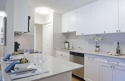 Braemar Gardens apartments kitchen featuring stainless steel appliances and white cupboards in Coquitlam, BC