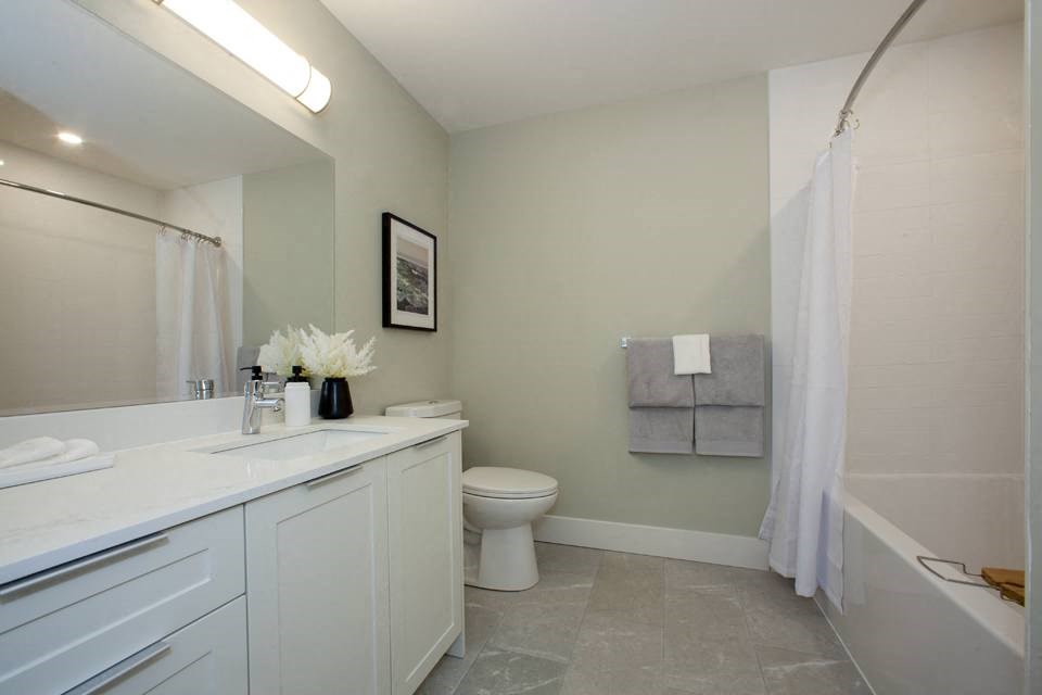 a bathroom with a toilet sink and bathtub