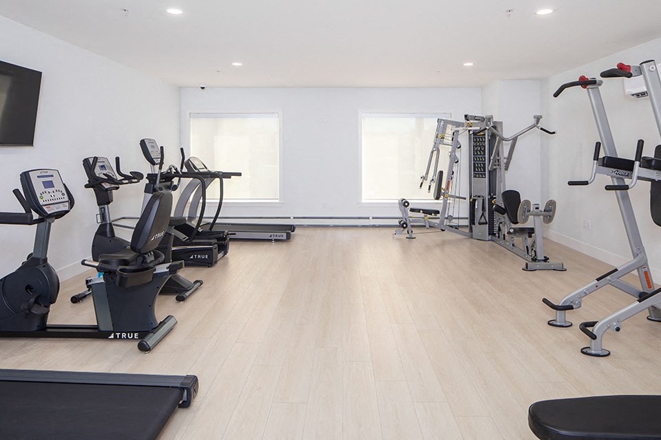 Gym with equipment at Brookline Apartments in Bedford NS