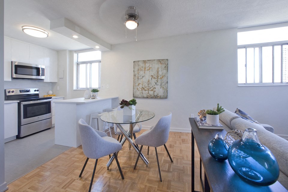 Cambridge Place Apartments open concept living area with view into kitchen in Scarborough, ON