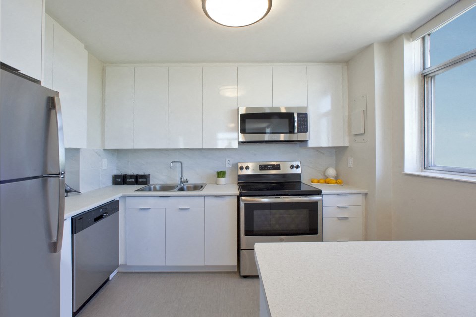 Cambridge Place Apartments kitchen featuring stainless steel appliances and contemporary cabinetry in Scarborough, ON