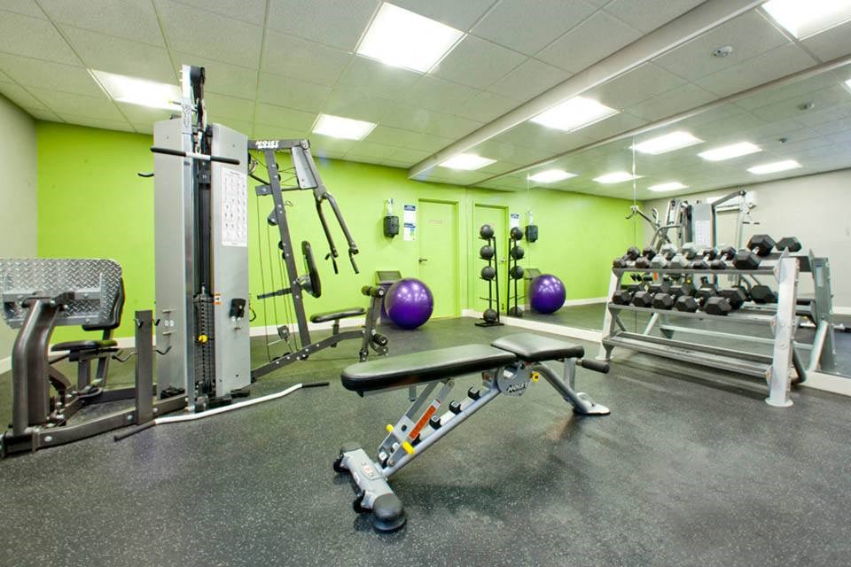 Cedarwoods Tower in Kitchener, ON gym with cardio machines and weights