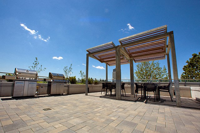 Cityview Apartments Gazebo next to two barbecues on a bright sunny day in Brampton, ON