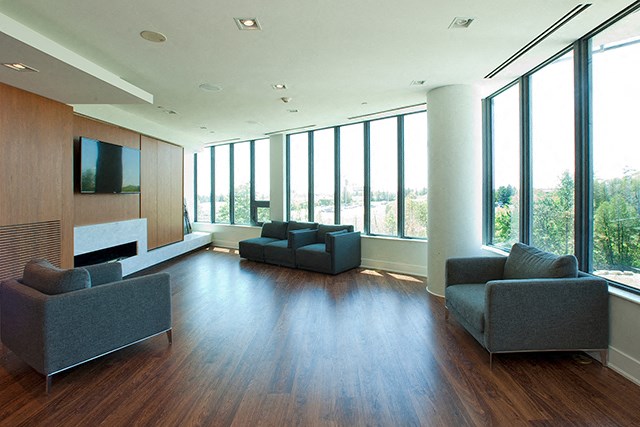 Cityview Apartments Social room with grey chairs and a flat screen tv in Brampton, ON